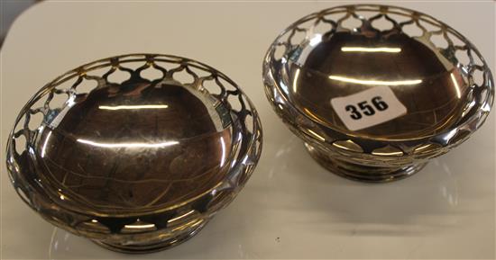 A pair of silver bon bon dishes